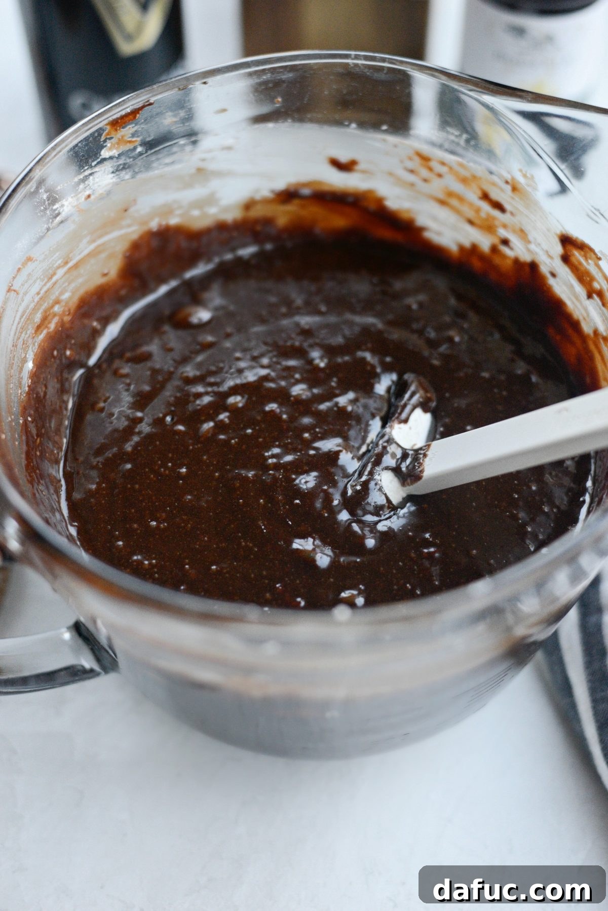 Close-up of brownie batter with no visible traces of flour, demonstrating proper mixing