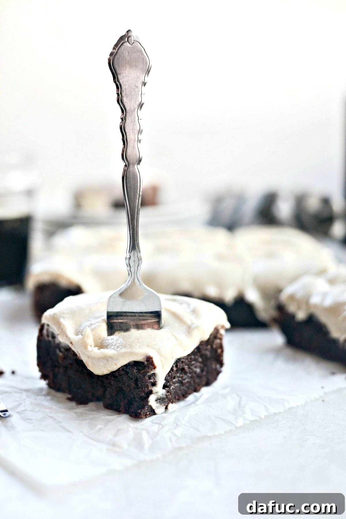 Close-up of freshly baked Chocolate Guinness Brownies with a thick layer of brown butter stout frosting