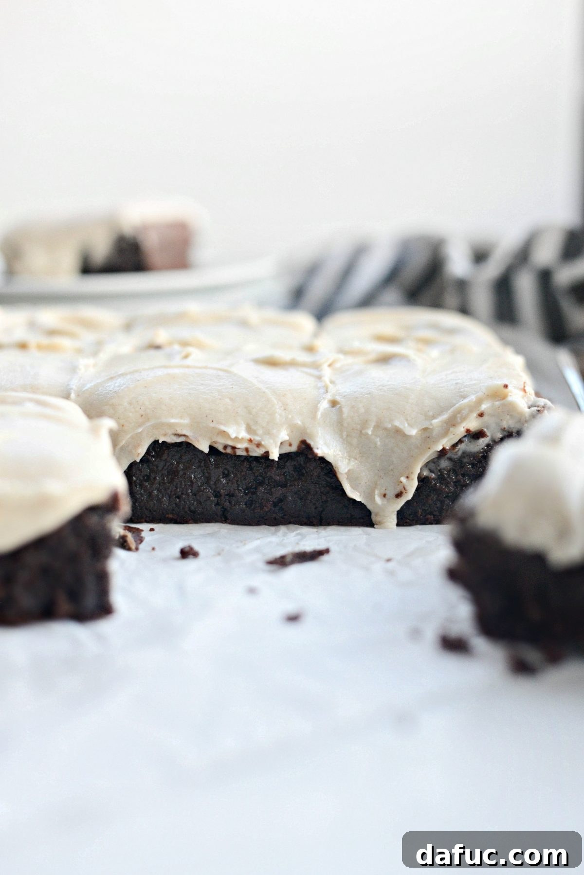Delicious square of Chocolate Guinness Brownie with thick frosting, ready to be enjoyed