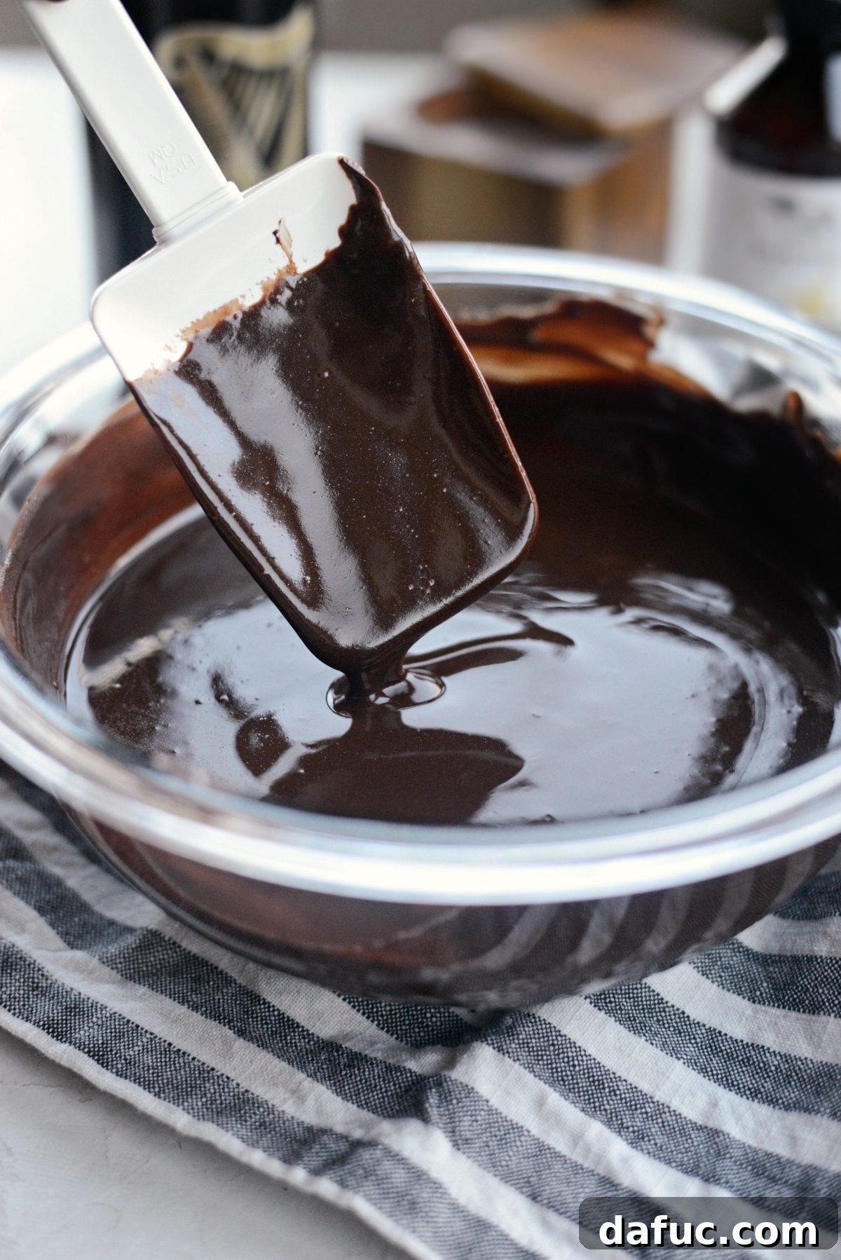 Perfectly melted, glossy chocolate and butter mixture after being removed from the double boiler