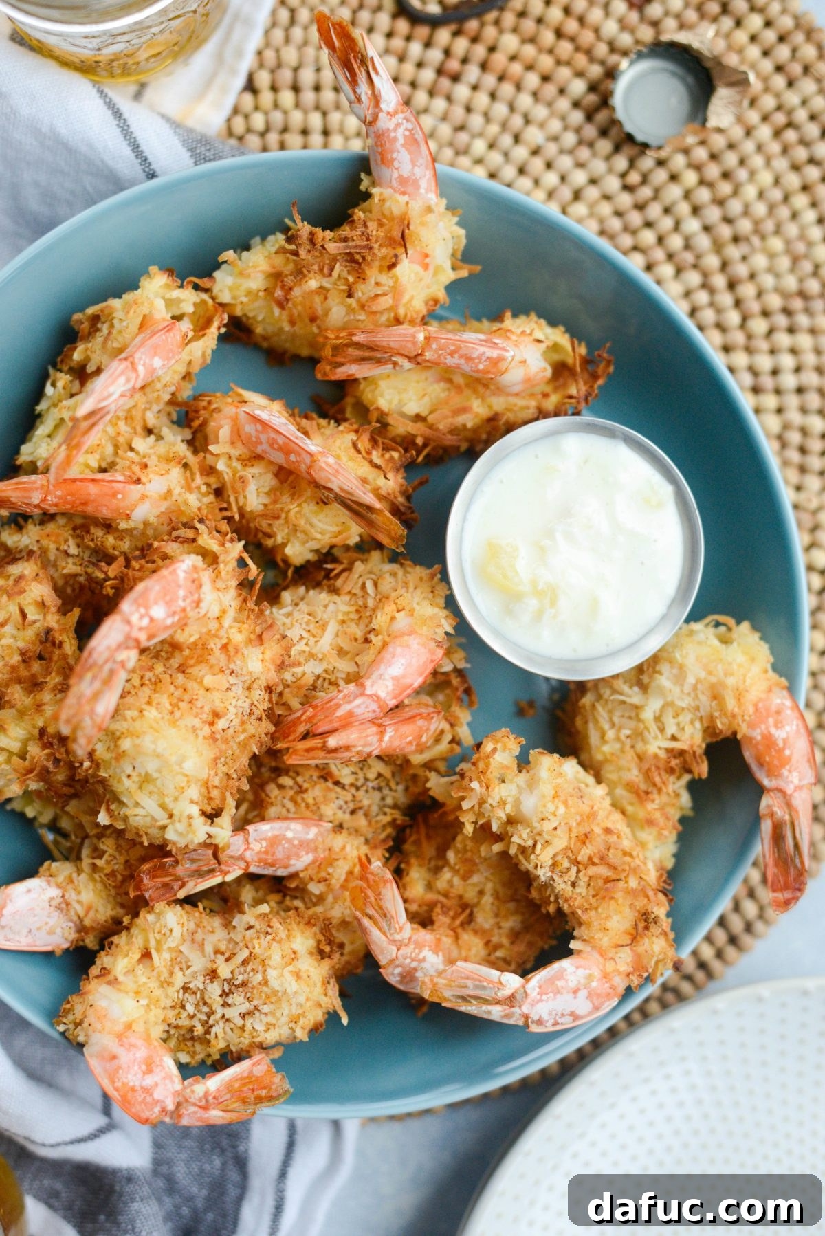 Tropical Crispy Air-Fried Coconut Shrimp with Pineapple Coconut Yogurt Dip 19 Air-Fryer Coconut Shrimp with Pineapple Coconut Yogurt Dip in blue dish
