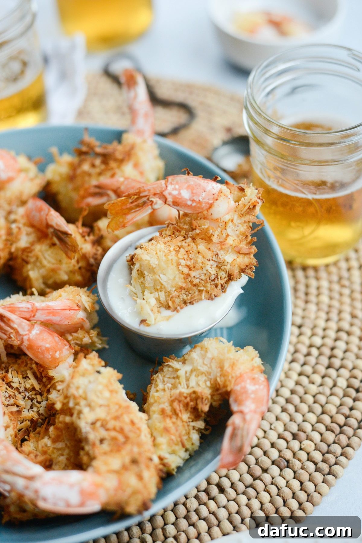 Tropical Crispy Air-Fried Coconut Shrimp with Pineapple Coconut Yogurt Dip 20 Air-Fryer Coconut Shrimp in small container of Pineapple Coconut Yogurt Dip
