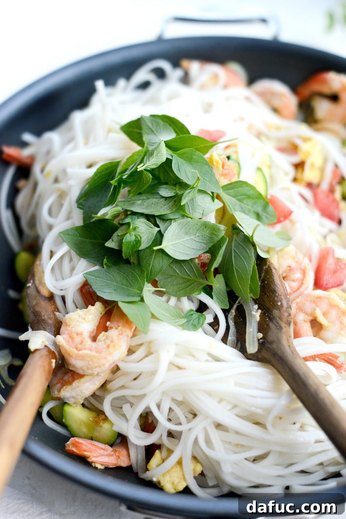 Adding Thai Basil to the stir-fry