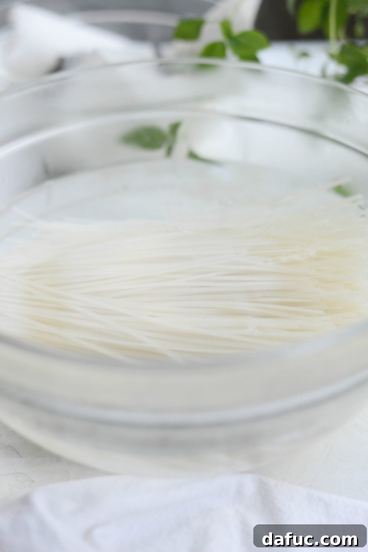 Soaking rice noodles in boiling water