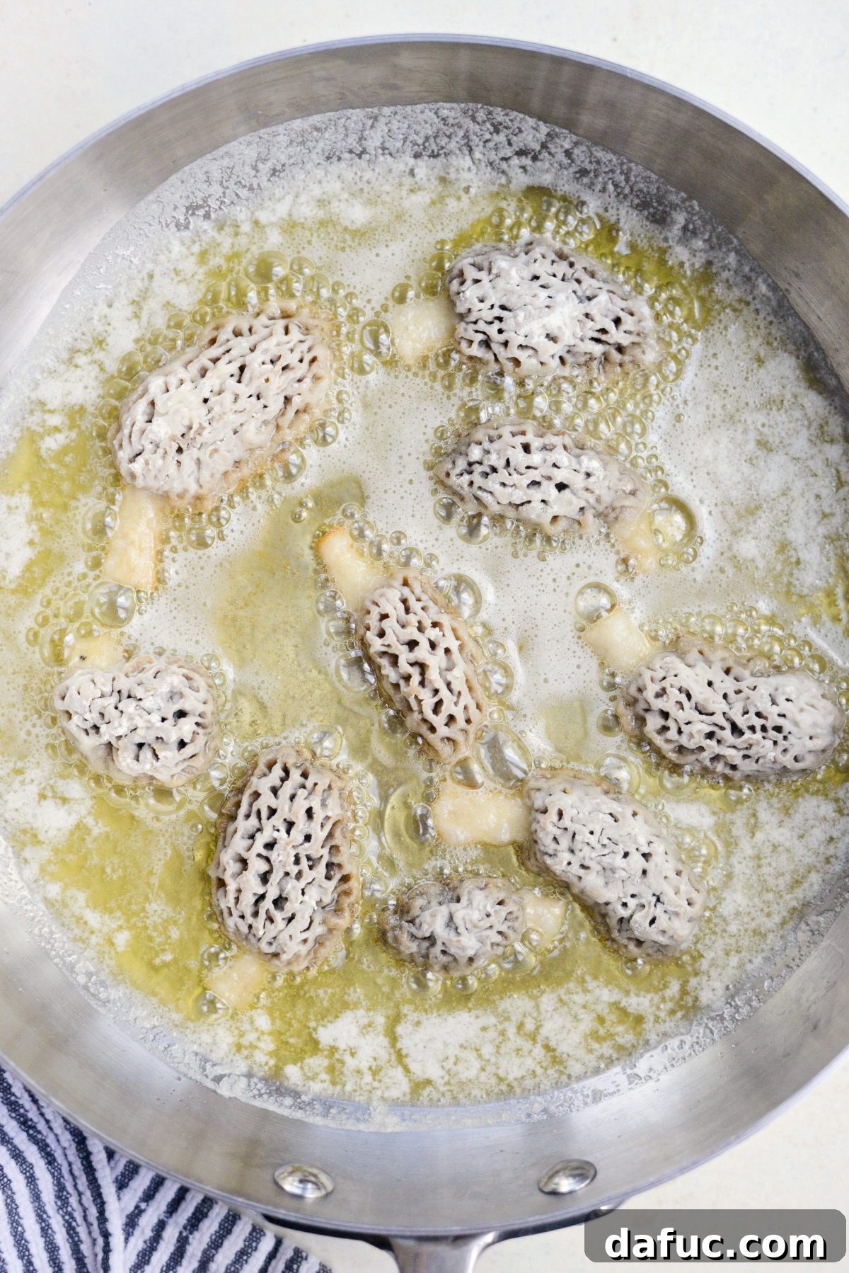 Spring's Wild Morel Sauté 17 Pan-frying morel mushrooms in butter