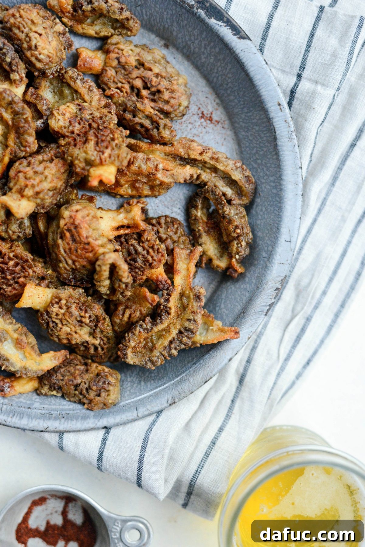 Spring's Wild Morel Sauté 21 Pan-fried morel mushrooms on a serving plate