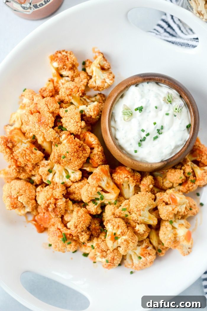 Serving Air Fryer Buffalo Cauliflower Bites with Blue Cheese Dip