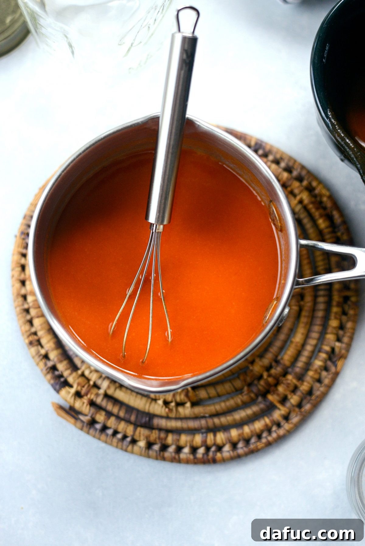 Whisking Buffalo Sauce Ingredients Together