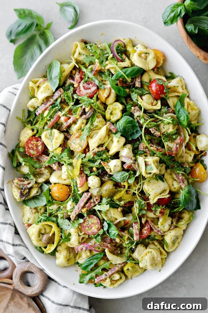 Italian Tortellini Pasta Salad served in a white bowl, close-up with focus on texture
