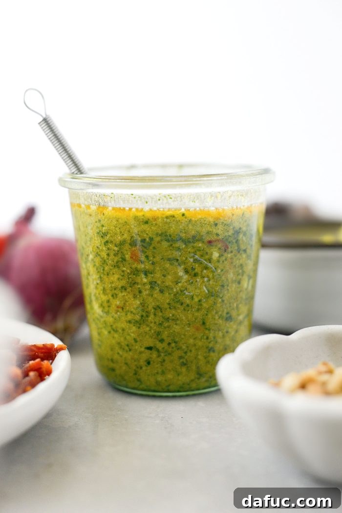 Close up of Basil Pesto Vinaigrette, freshly mixed in a jar