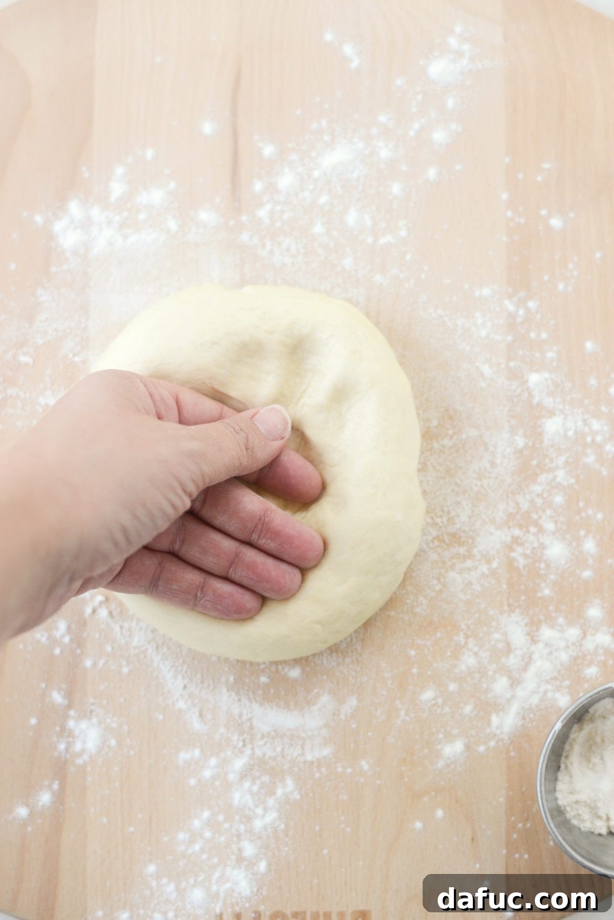 Mastering Homemade Pizza Dough 13 Punching down risen pizza dough
