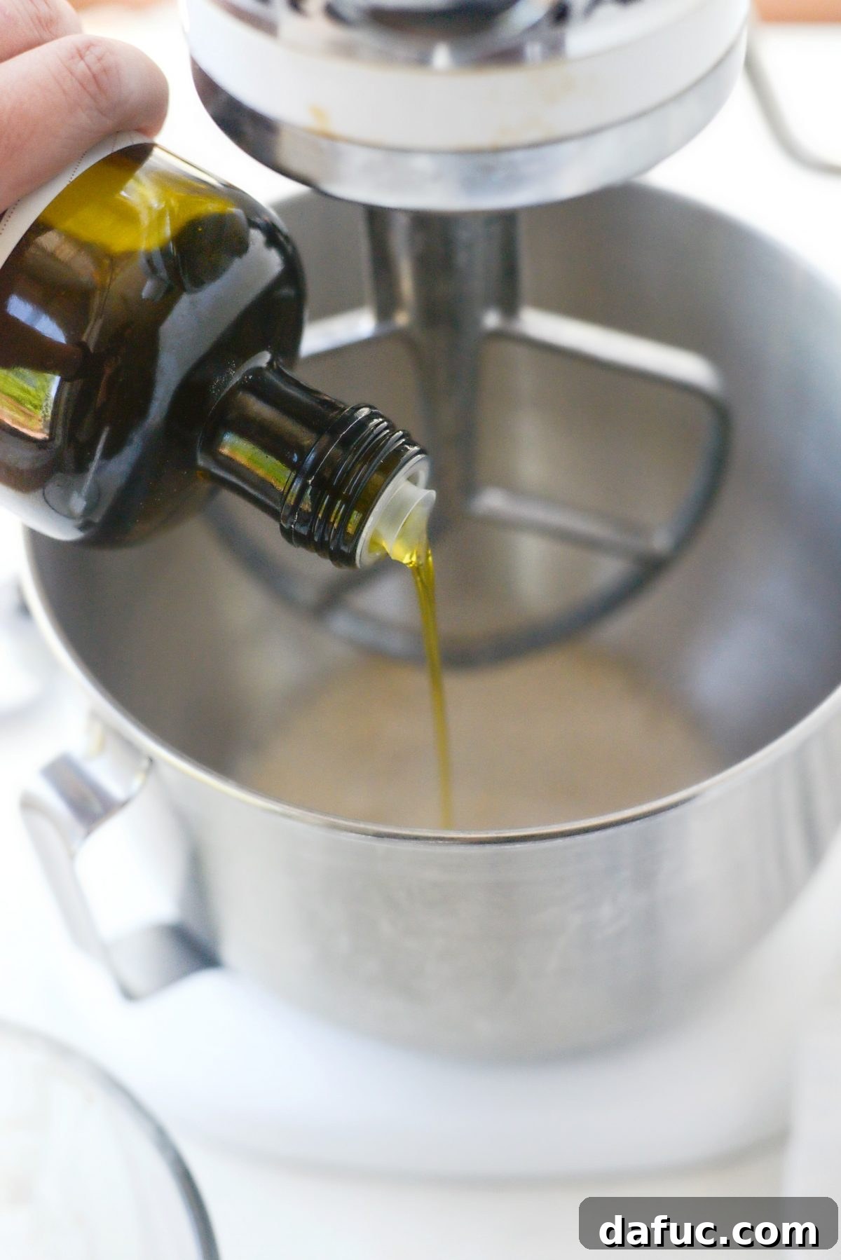 Mastering Homemade Pizza Dough 8 Yeast mixture with olive oil in a stand mixer