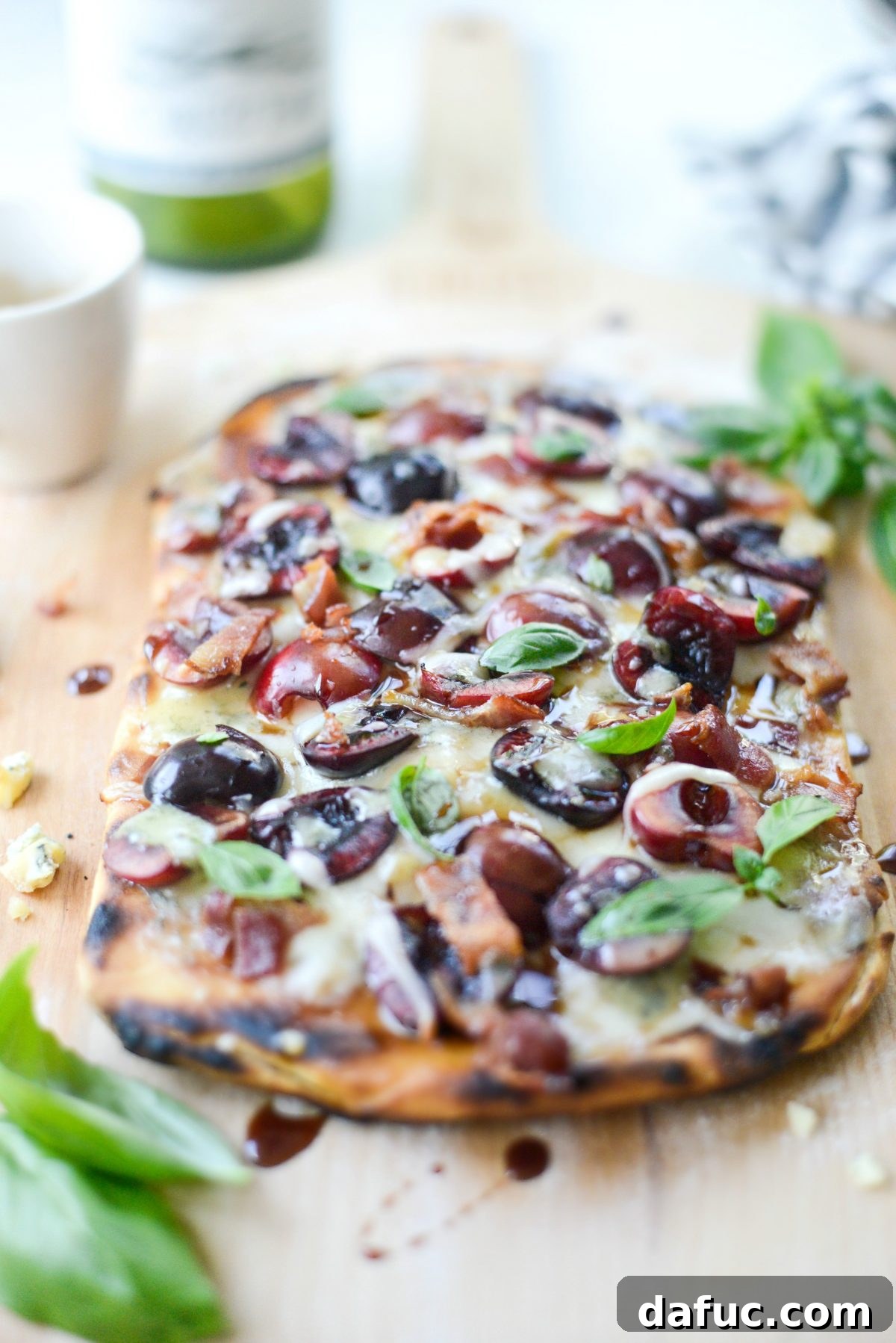 Close-up of freshly grilled flatbread with colorful toppings