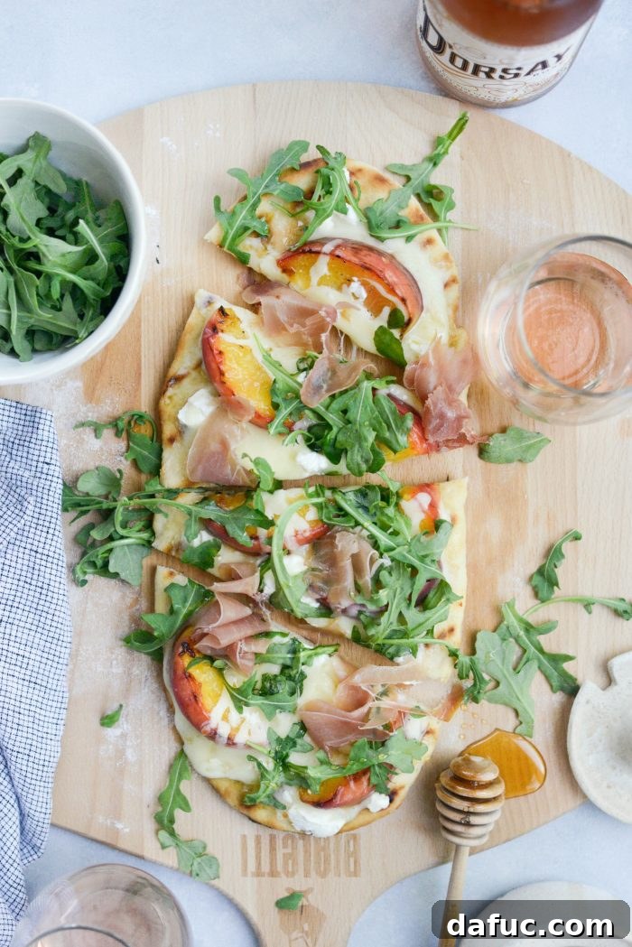 Beautifully plated slice of Grilled Peach, Goat Cheese and Prosciutto Flatbread