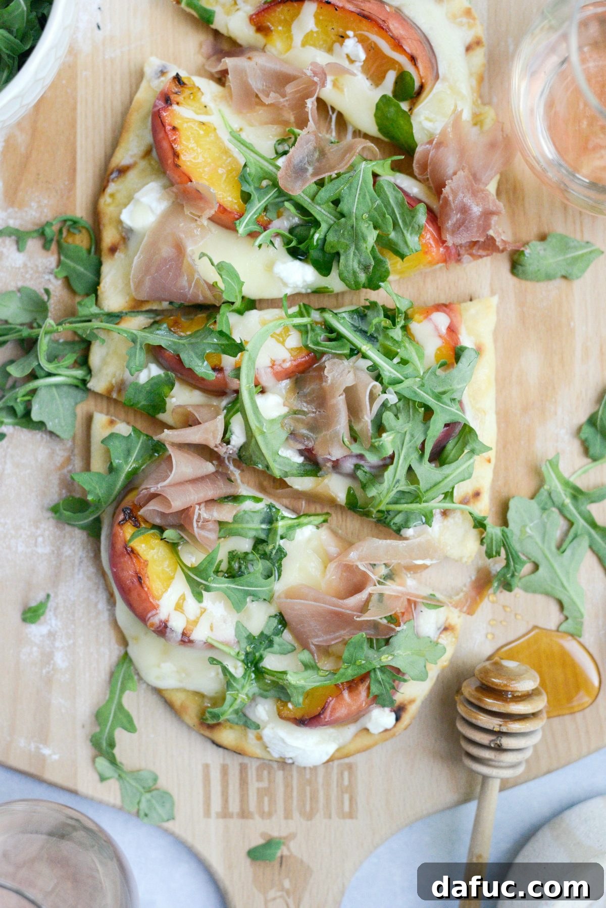 A final, close-up view of the Grilled Peach, Goat Cheese and Prosciutto Flatbread, emphasizing its delicious texture