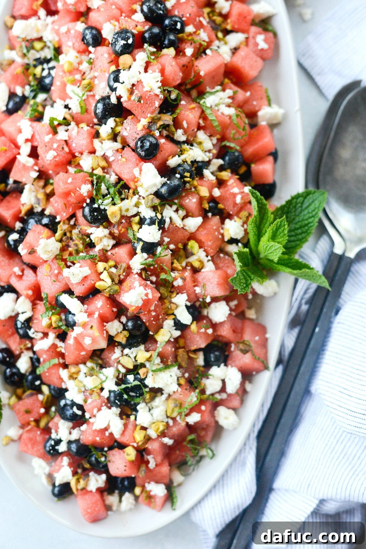 Close-up of Watermelon Blueberry Feta Salad with feta and mint.