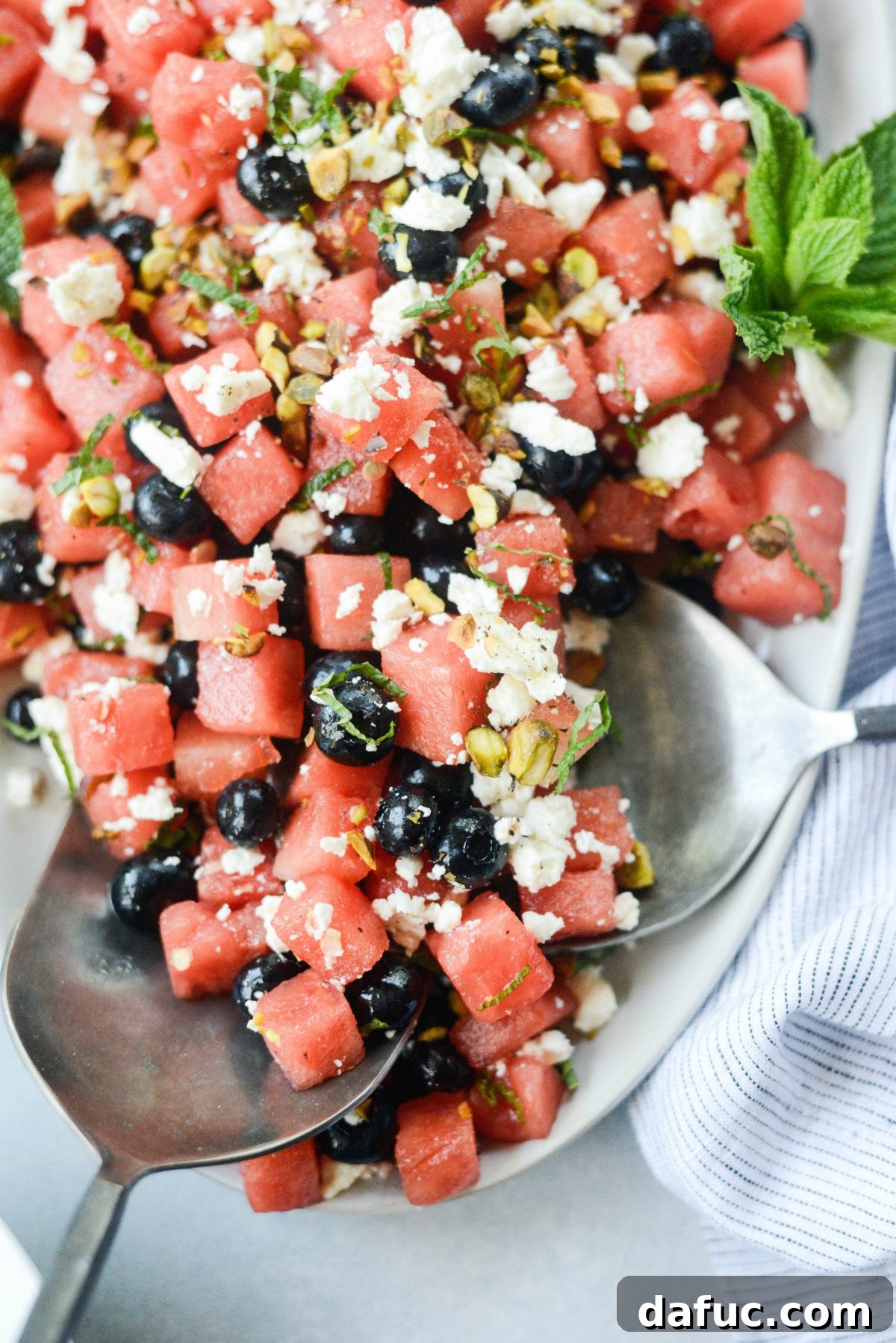 Watermelon Blueberry Feta Salad in a glass bowl, ready to be served.