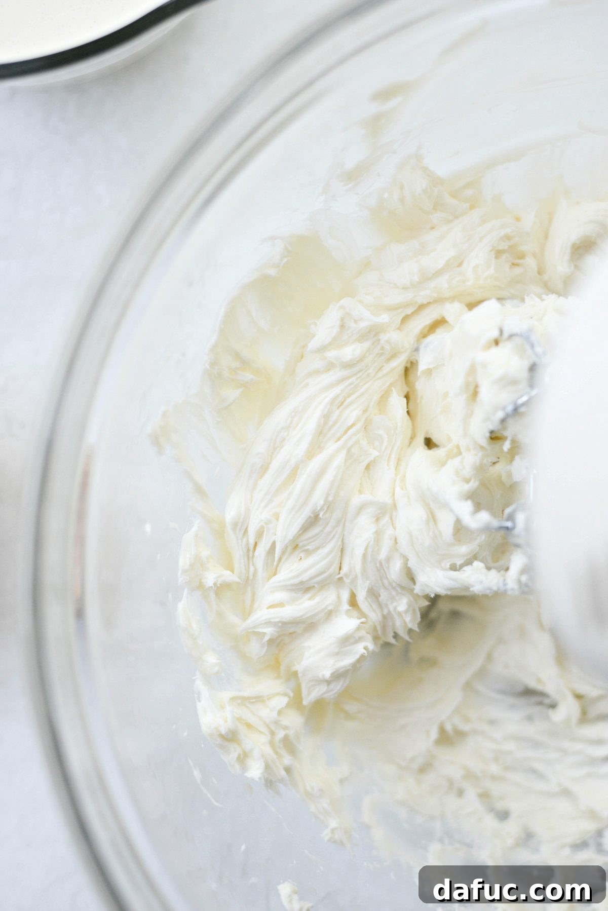 Cream cheese mixture being blended until smooth and lump-free