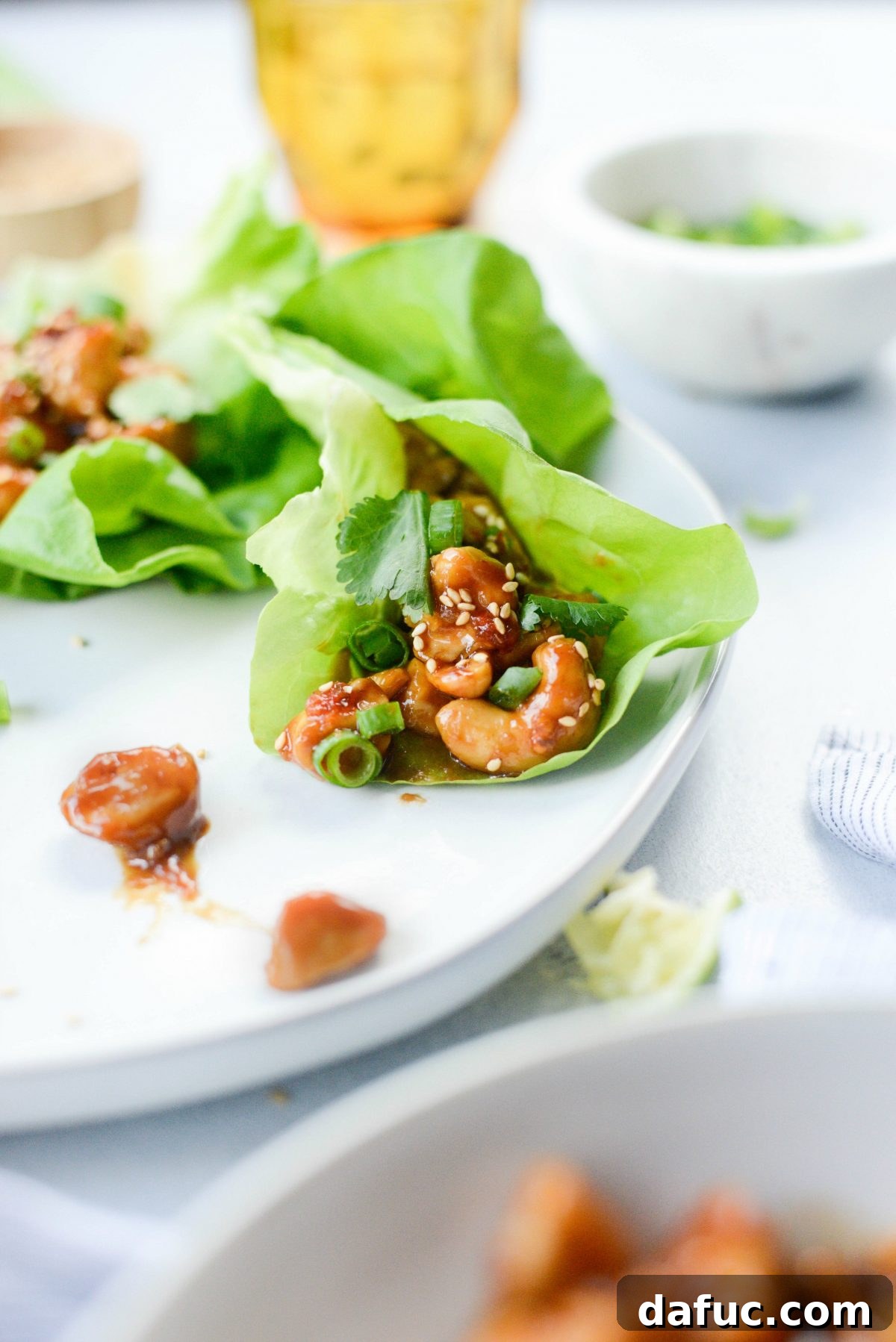 Finished Thai Cashew Chicken Lettuce Wraps on a platter.