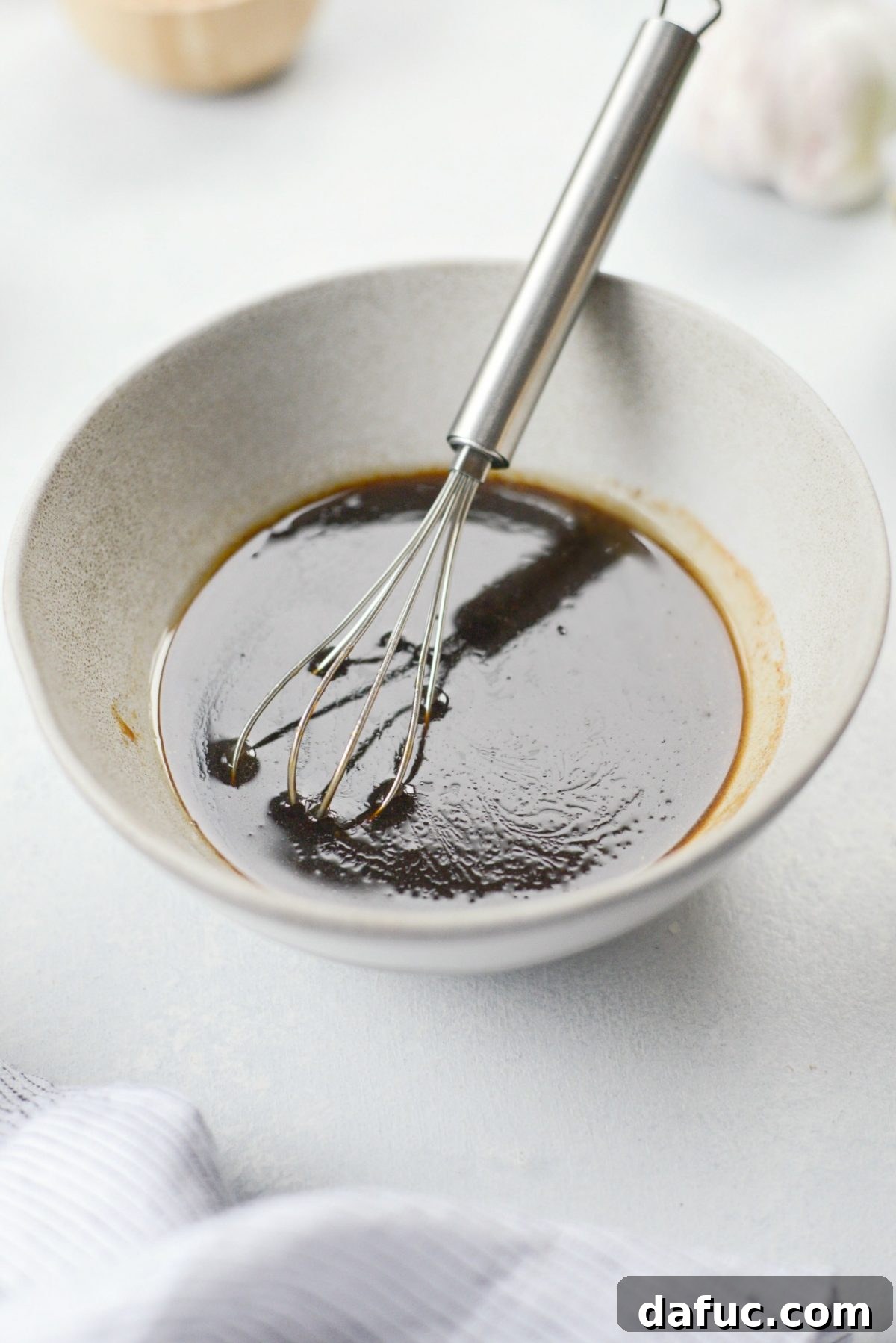 Mixing the stir-fry sauce ingredients in a bowl.