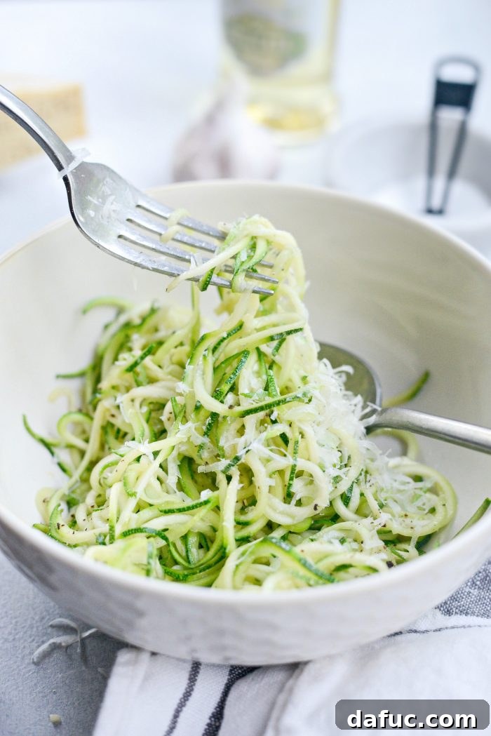 Delicious Garlic Parmesan Zoodles ready to serve, garnished with fresh herbs