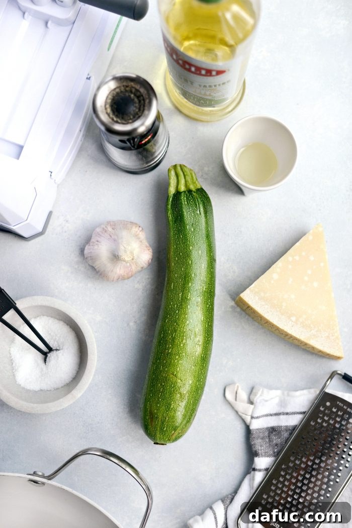 Fresh ingredients for Garlic Parmesan Zoodles laid out on a cutting board