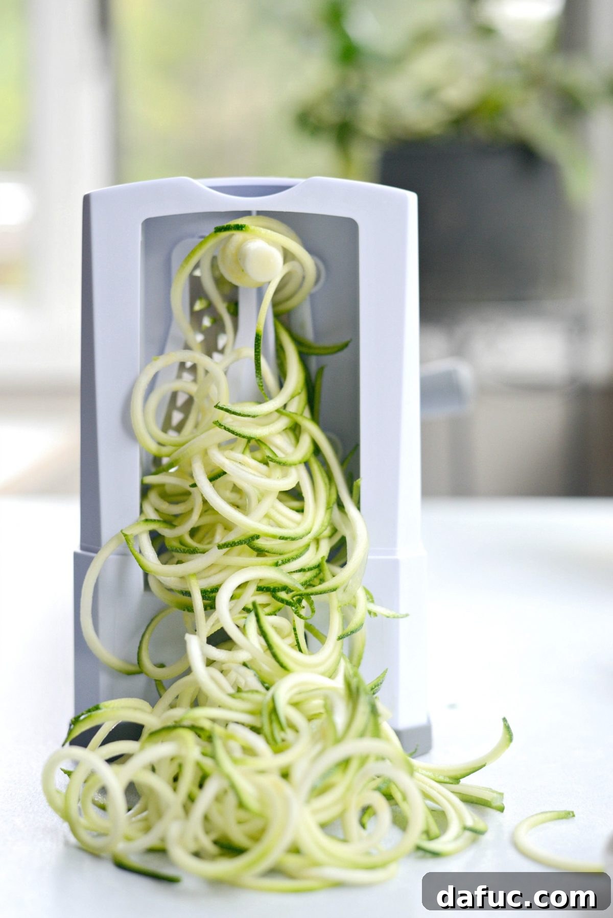 Quick and Flavorful Garlic Parmesan Zucchini Noodles 5 Spiralizing fresh zucchini into noodles