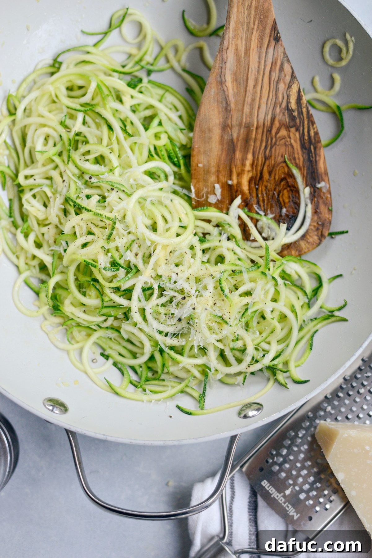 Quick and Flavorful Garlic Parmesan Zucchini Noodles 10 Topping Garlic Parmesan Zoodles with freshly grated Parmesan cheese