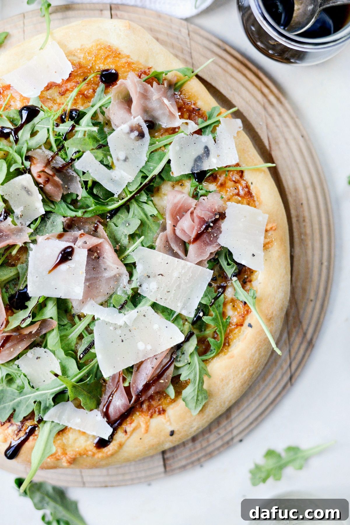 Fig Jam Prosciutto Pizza with Parmesan and Arugula after baking