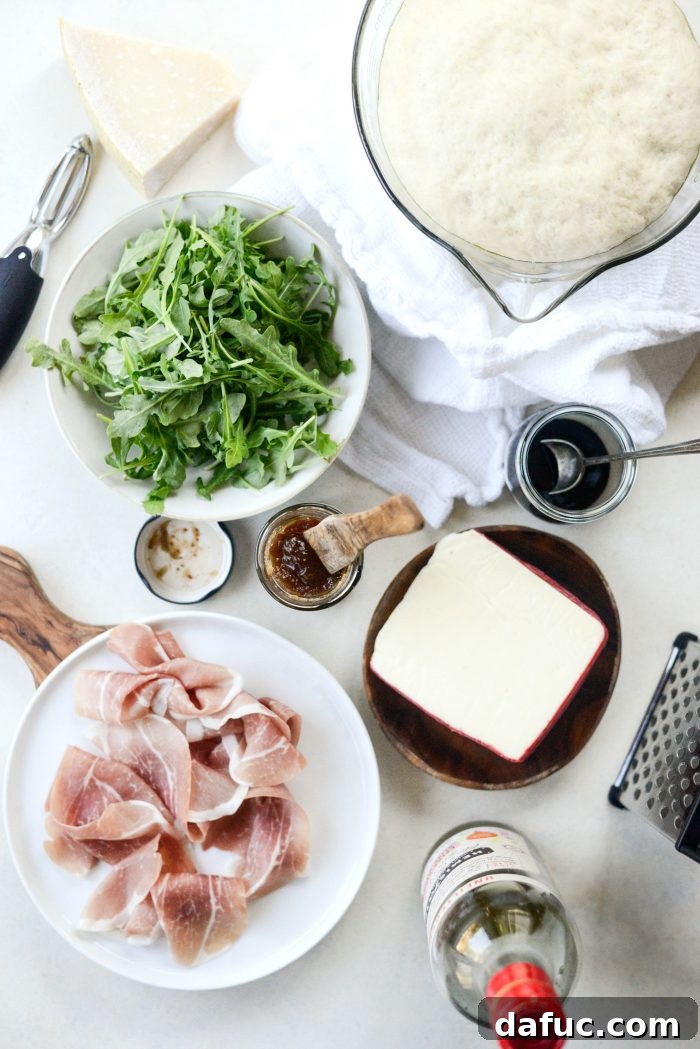 All ingredients for Fig Jam Prosciutto Pizza displayed