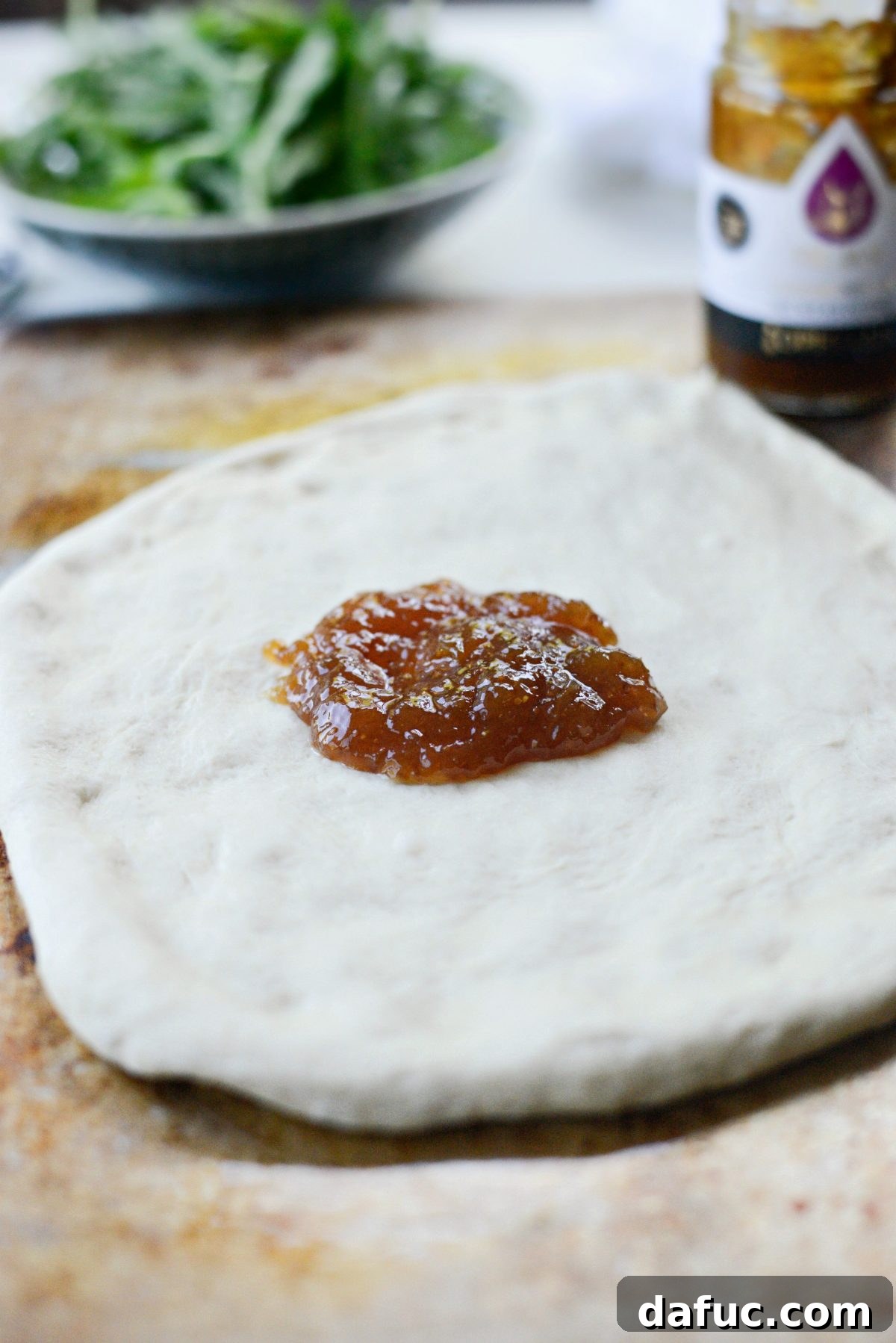 Adding fig jam to pizza dough