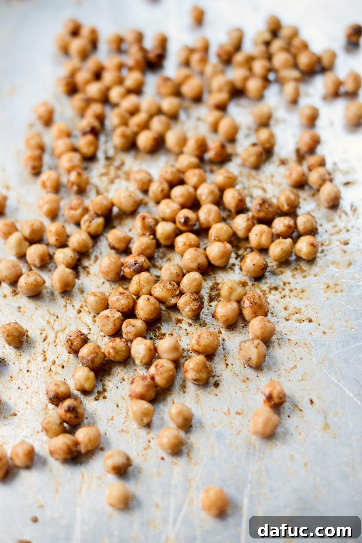 Shawarma Roasted Cauliflower & Chickpea Bowl 6 Crispy roasted chickpeas on a baking sheet