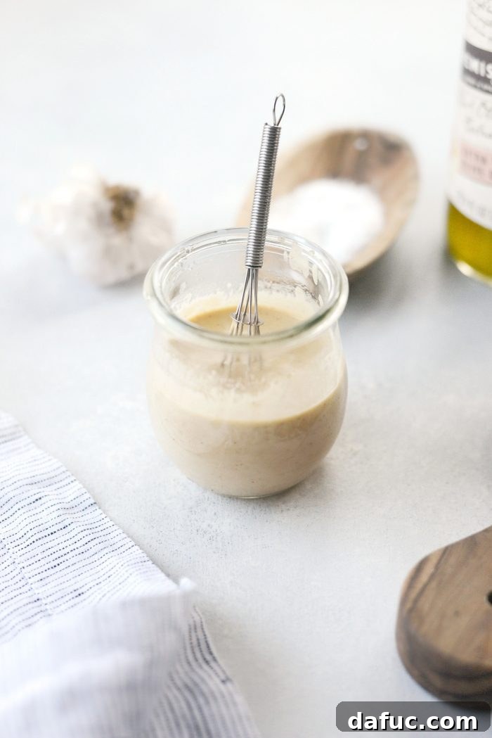 Zesty Lemon Tahini Dressing 2 Simple Lemon Tahini Dressing drizzled over fresh greens and roasted vegetables