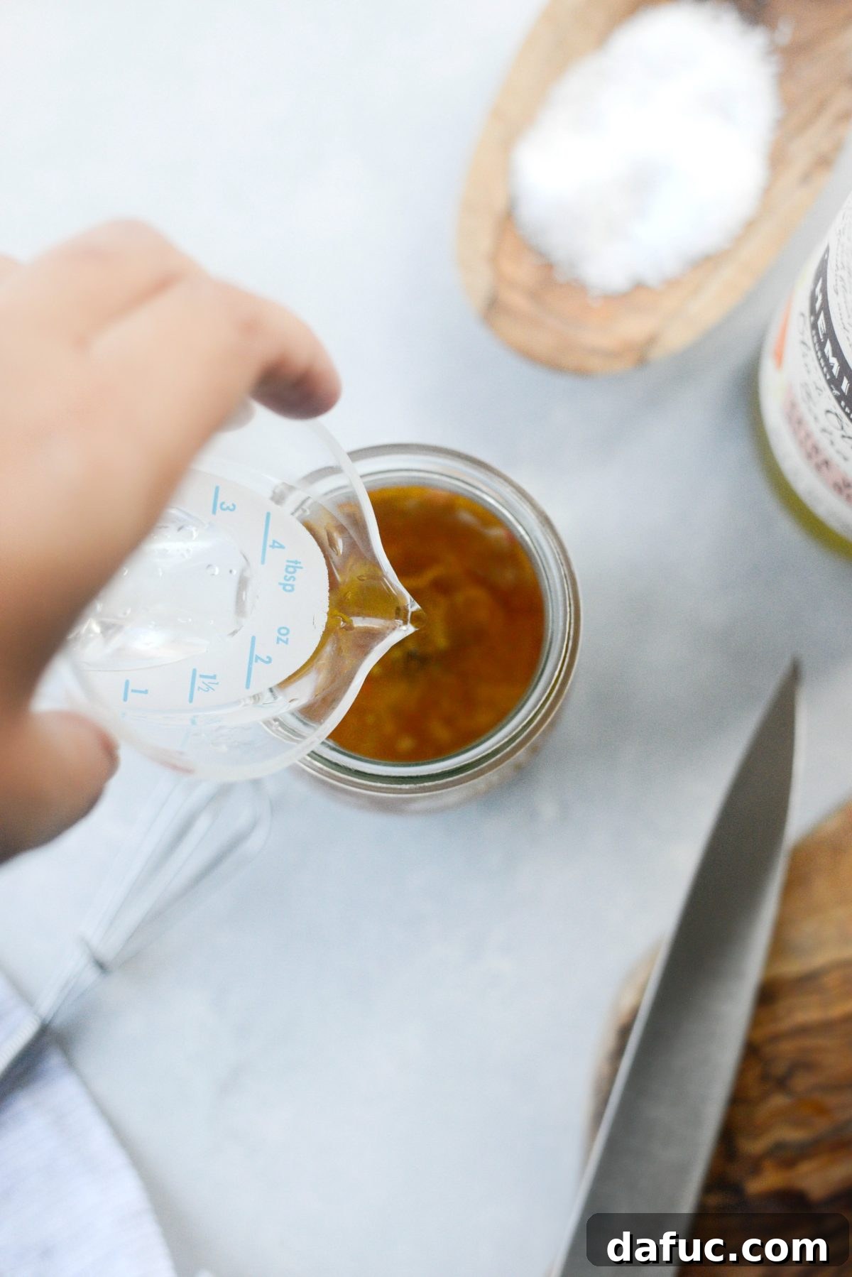 Zesty Lemon Tahini Dressing 7 Seasoning the tahini dressing with salt and thinning it with hot water