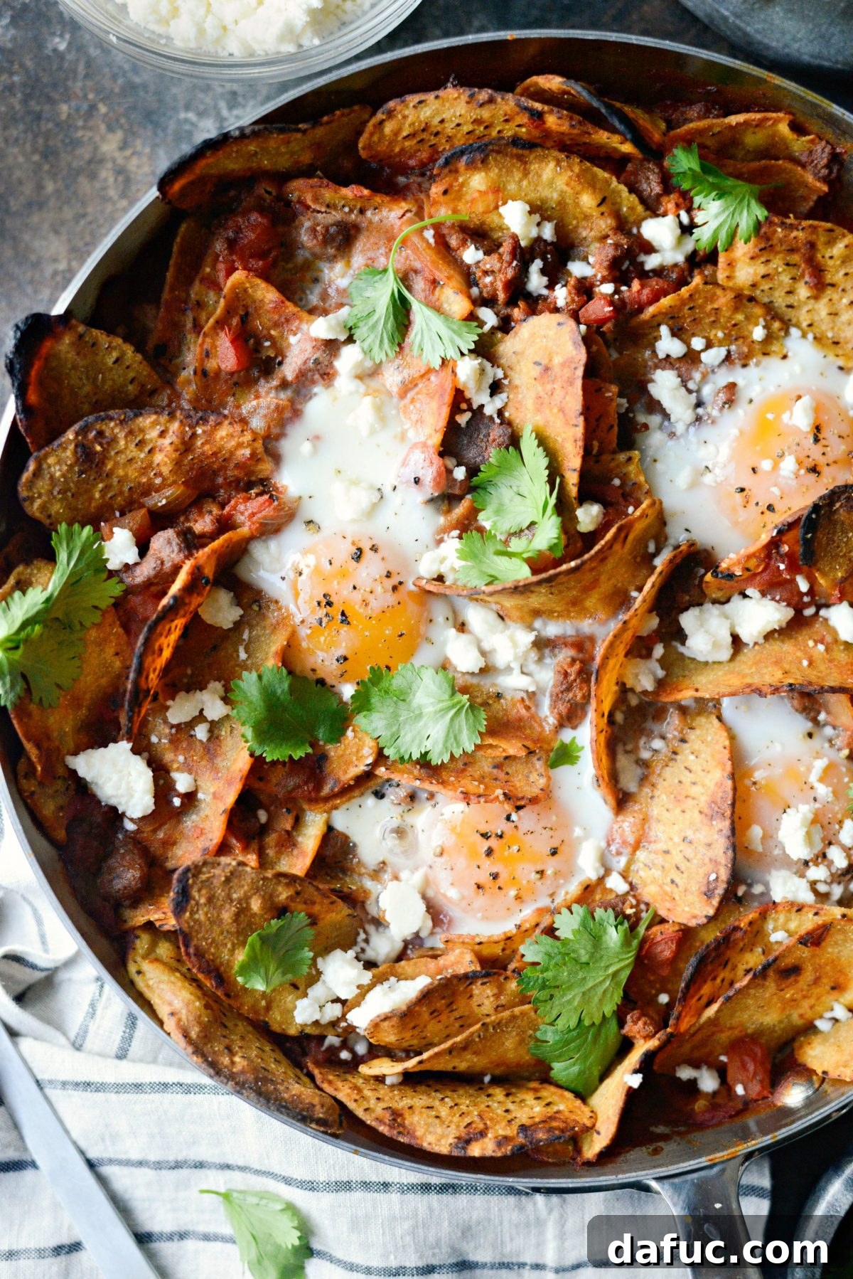 Hearty Chorizo and Sweet Potato Chilaquiles 2 Chorizo Sweet Potato Chilaquiles in a cast iron skillet, ready to be served