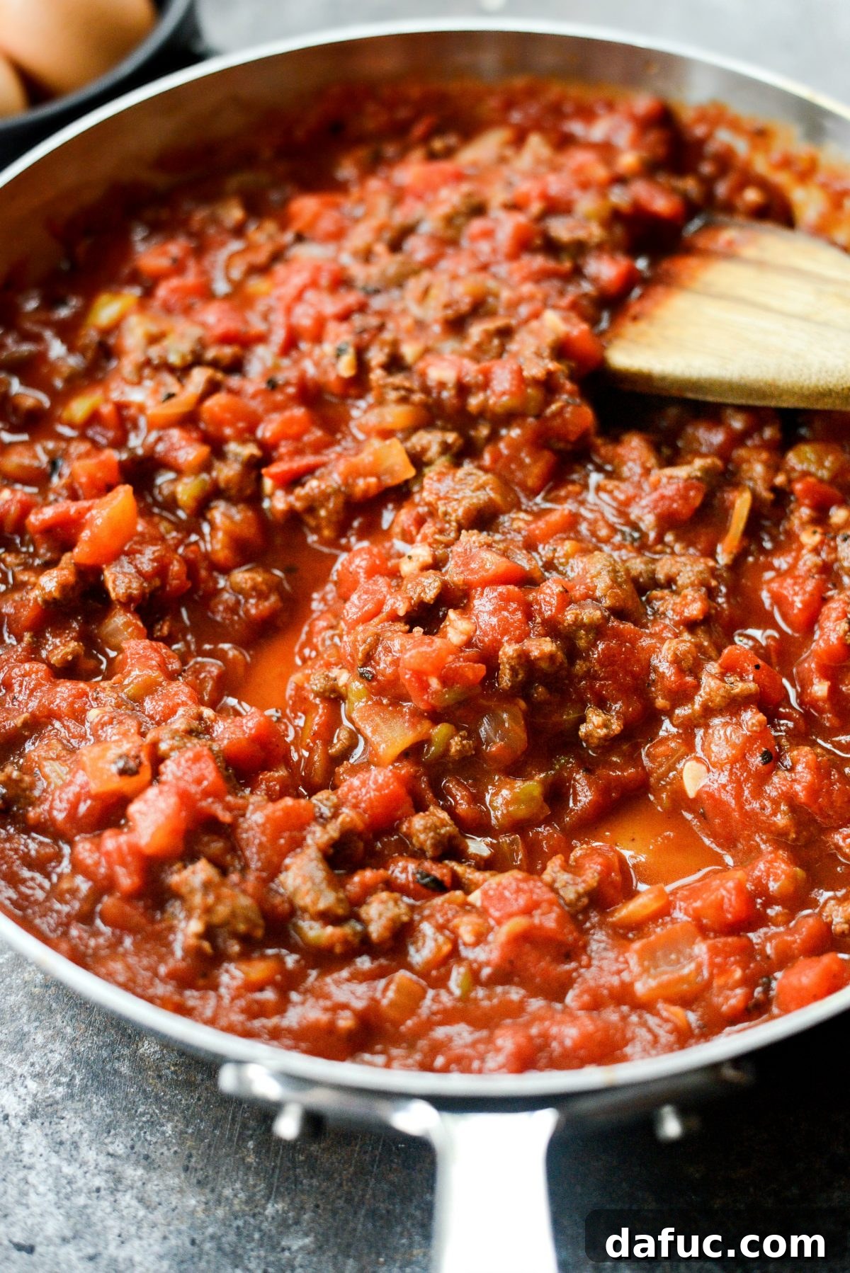 Hearty Chorizo and Sweet Potato Chilaquiles 11 Stirring chorizo into the tomato sauce