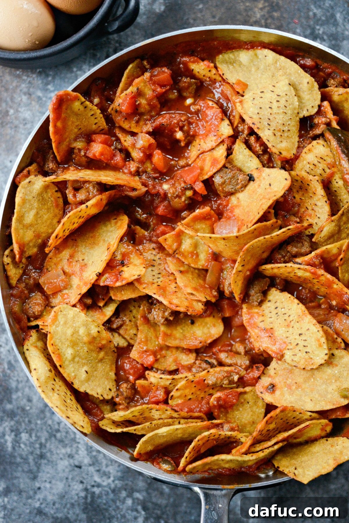 Hearty Chorizo and Sweet Potato Chilaquiles 13 Gently tossing sweet potato chips into the chilaquiles sauce