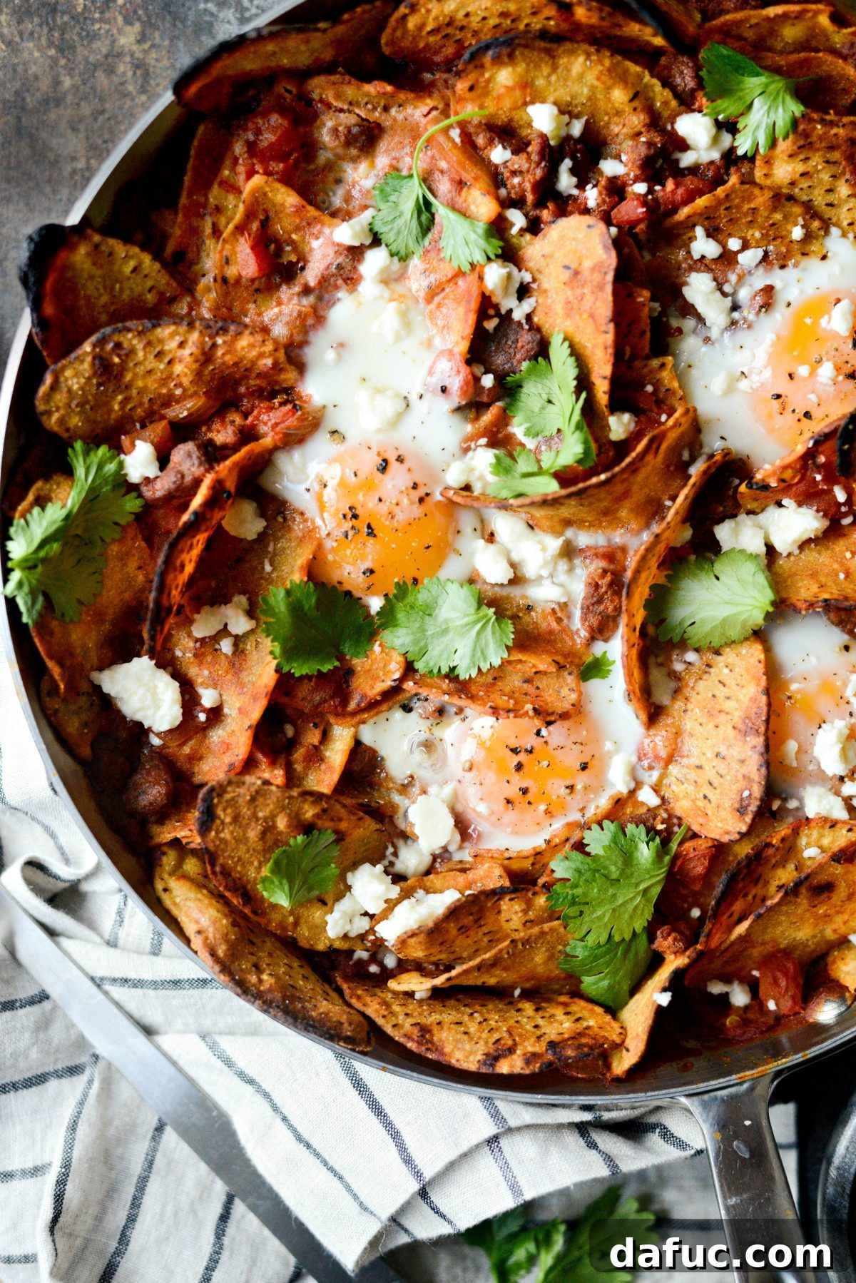 Hearty Chorizo and Sweet Potato Chilaquiles 18 Chorizo Sweet Potato Chilaquiles garnished with queso fresco, cilantro, and lime