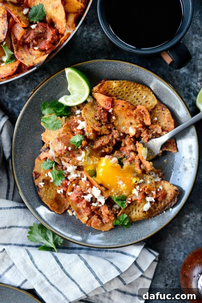 Hearty Chorizo and Sweet Potato Chilaquiles 20 Overhead shot of a full skillet of Chorizo Sweet Potato Chilaquiles, garnished and ready to eat