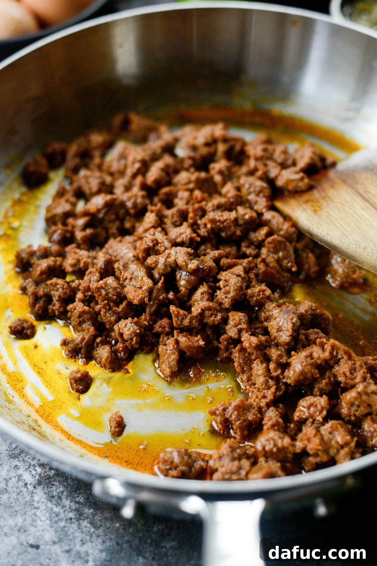 Hearty Chorizo and Sweet Potato Chilaquiles 5 Cooking chorizo sausage in a cast iron skillet