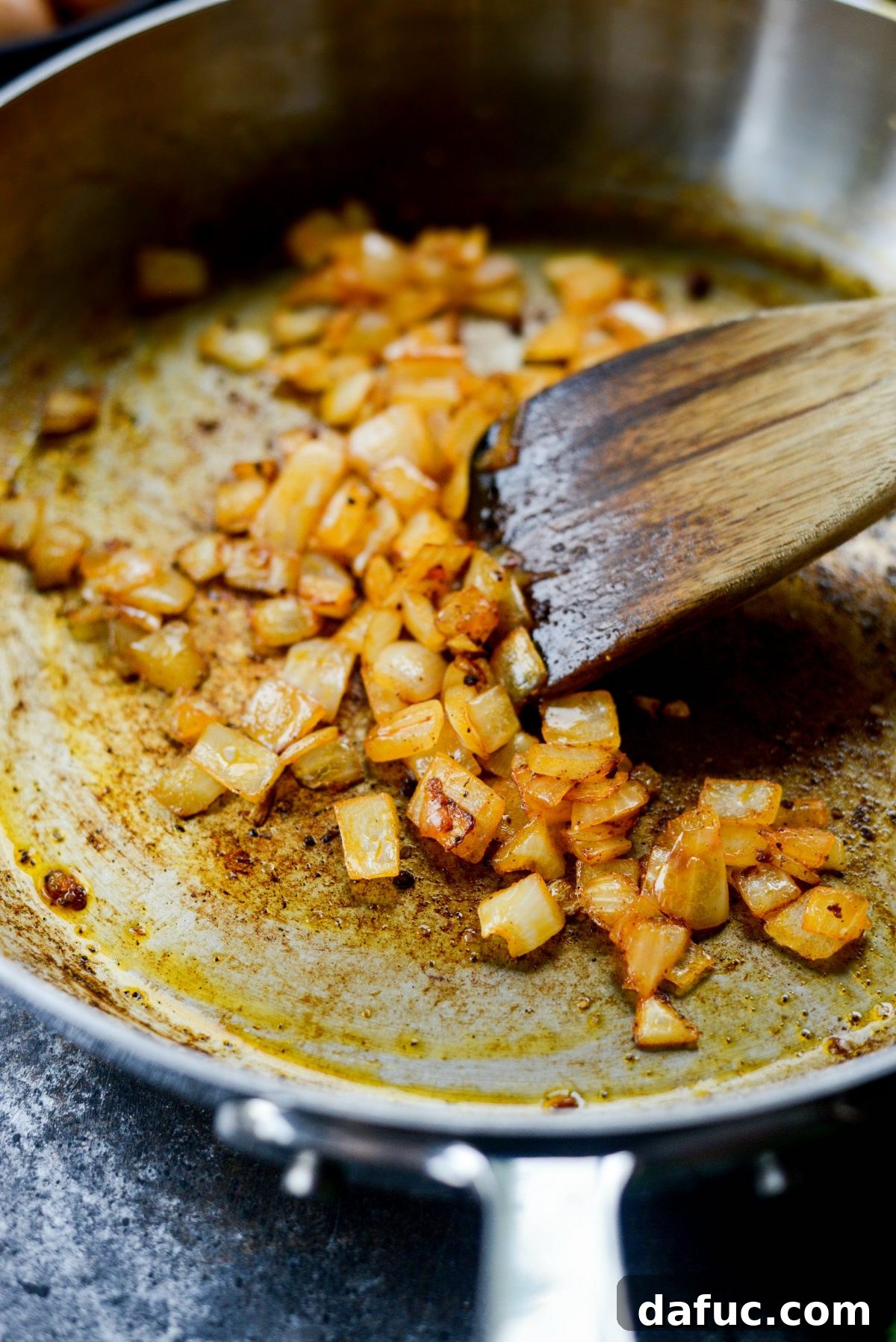 Hearty Chorizo and Sweet Potato Chilaquiles 7 Caramelized diced yellow onions in a skillet
