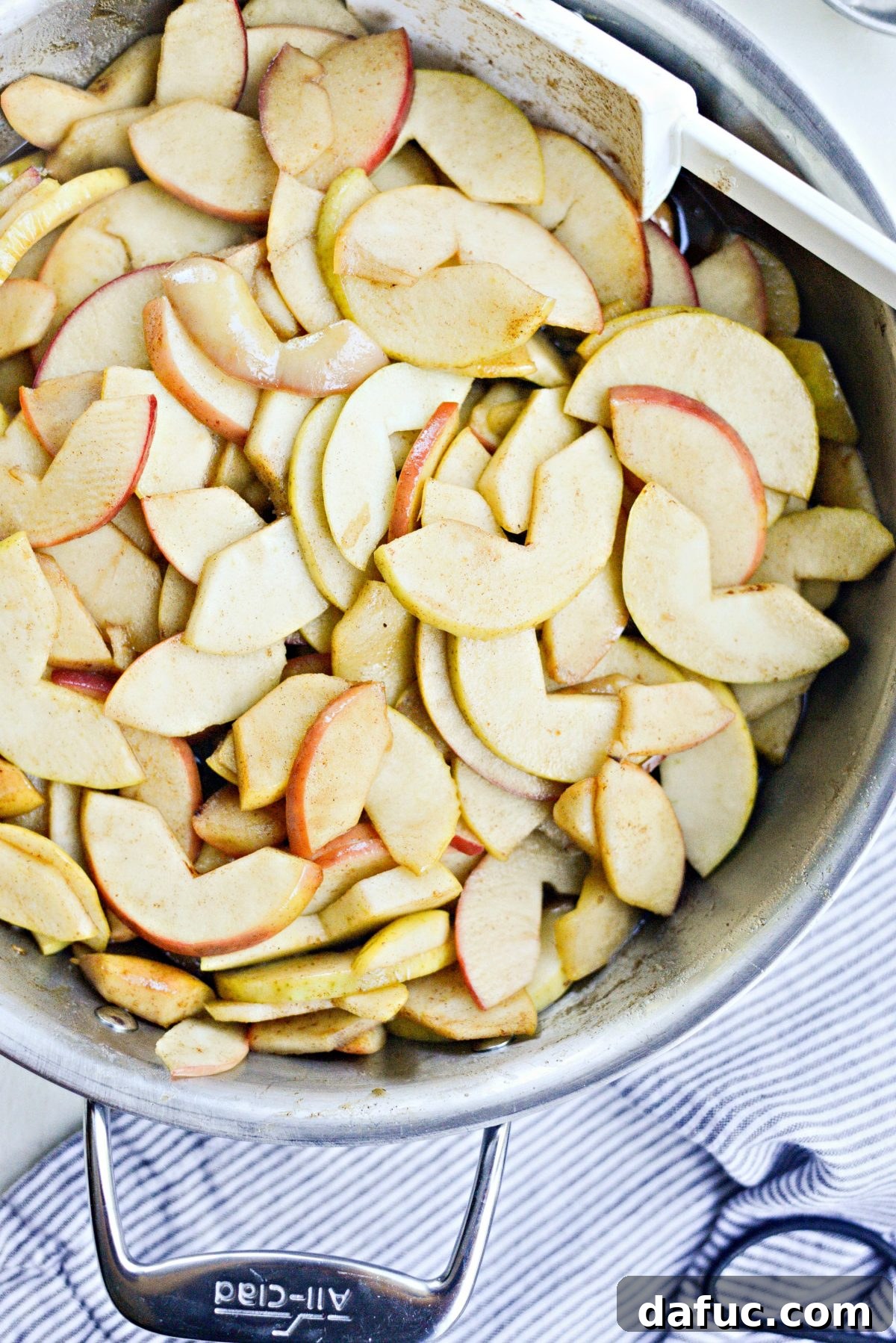 Combined apples, sugars, lemon juice, and spices after thickening
