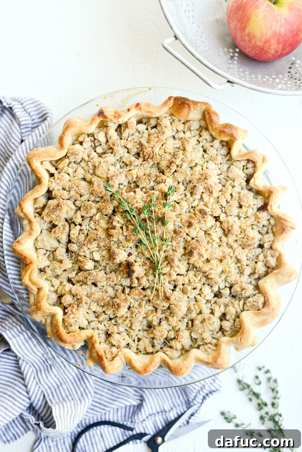 Rustic Brown Sugar Apple Pie with Oatmeal Thyme Crumble, ready to be enjoyed