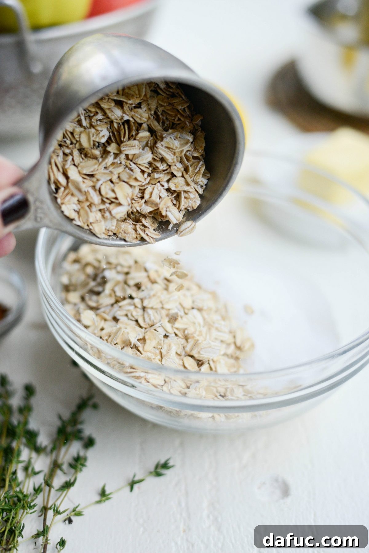 Oats, flours, and granulated sugar in a mixing bowl