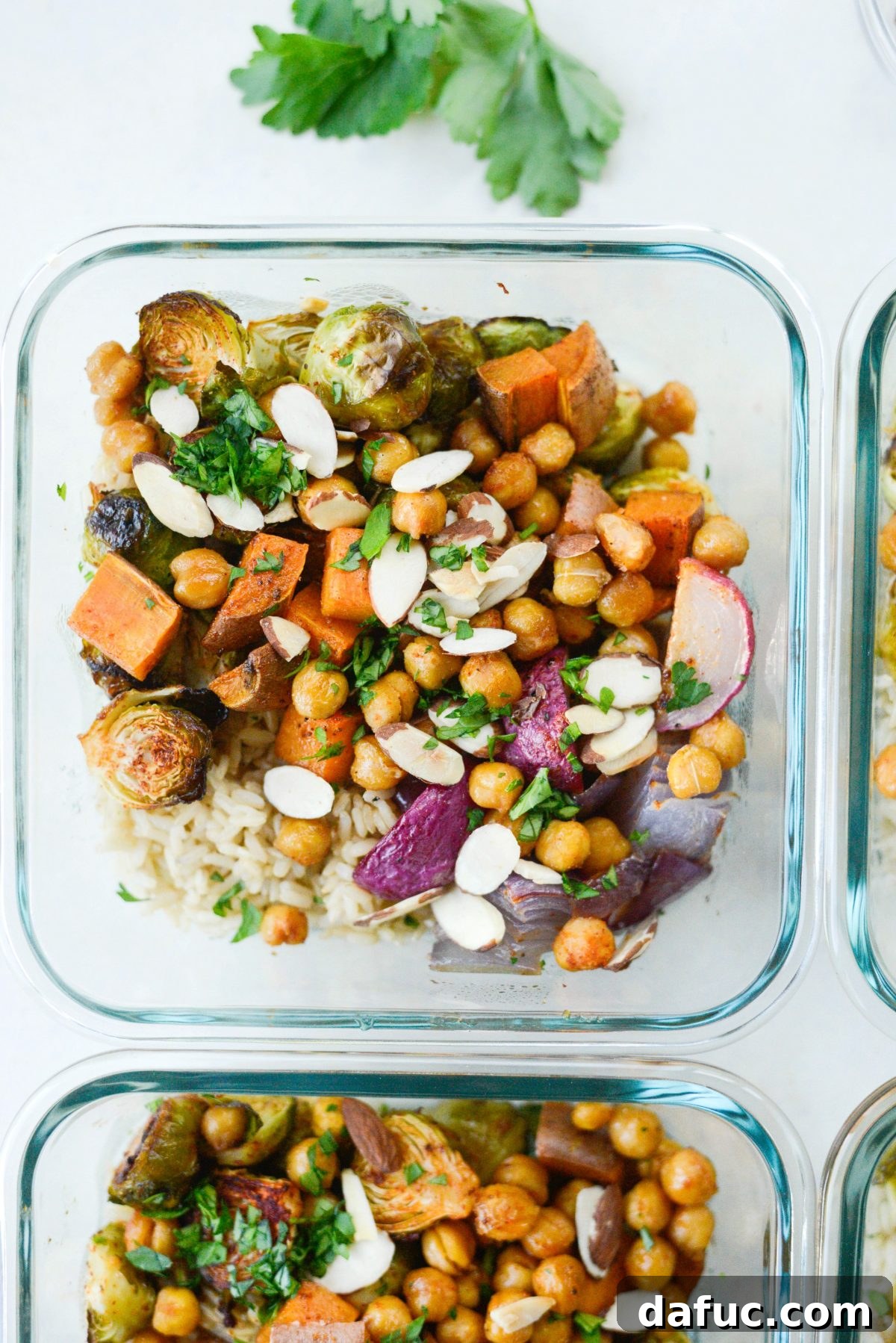Make-Ahead Roasted Fall Veggie Rice Bowls 13 top with almonds and parsley