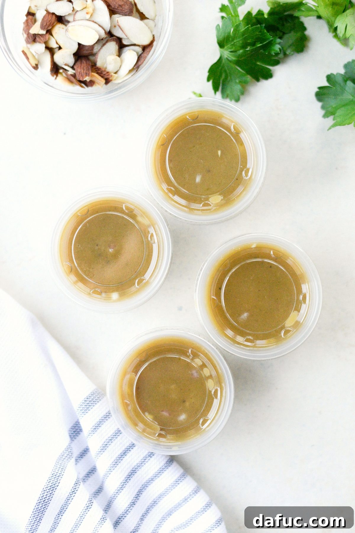 Make-Ahead Roasted Fall Veggie Rice Bowls 7 transfer dressing to spill proof containers