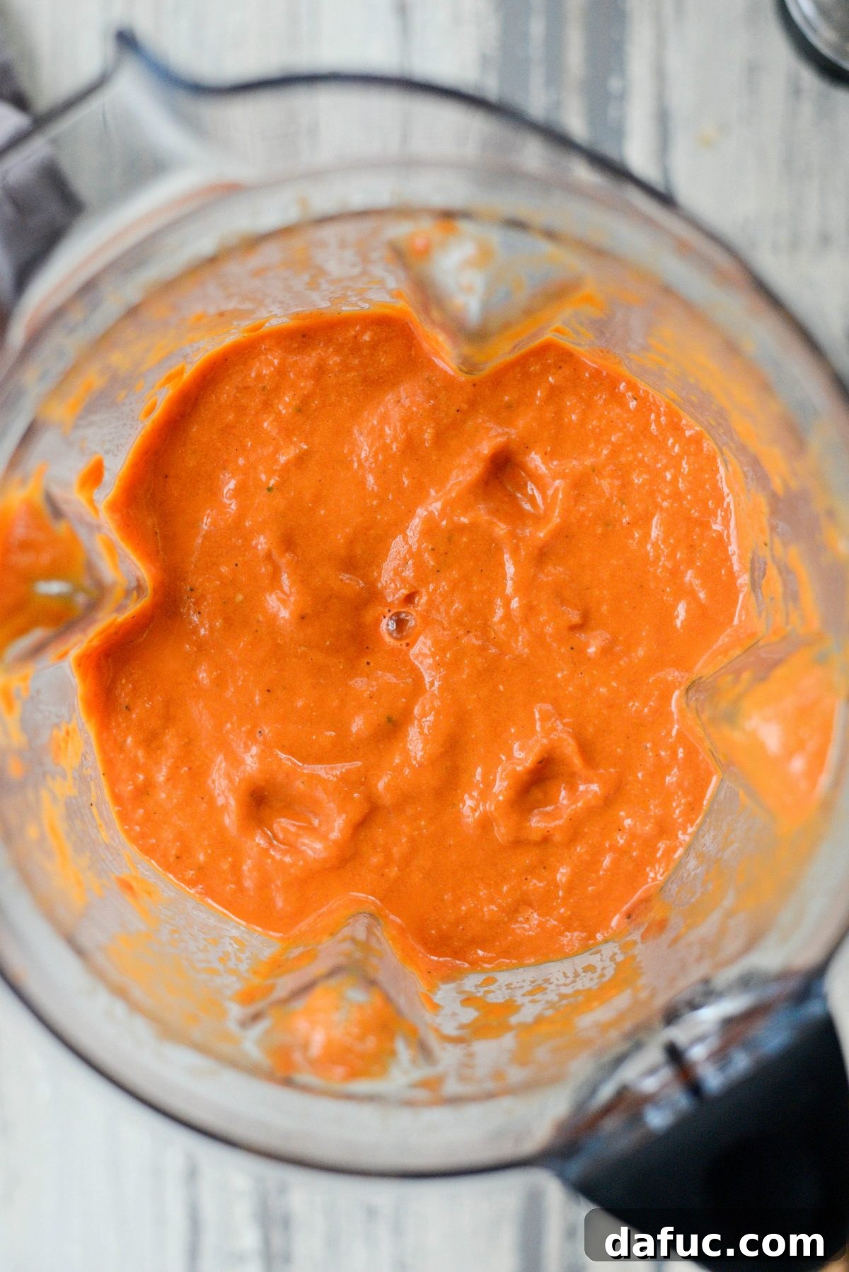 Velvety smooth blended soup in a high-speed blender, showcasing its rich, creamy texture.
