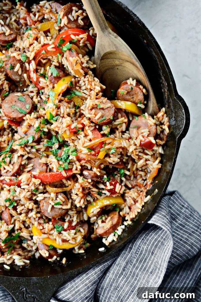 Andouille Cajun Rice Skillet with wooden serving spoon
