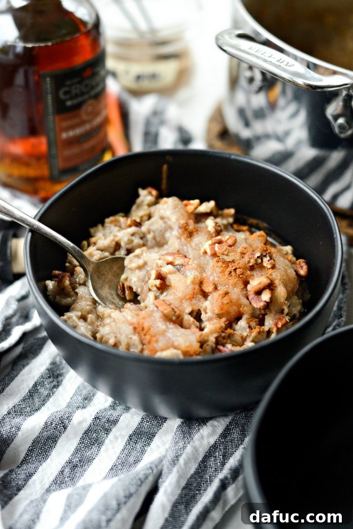 A wide shot of the Apple Chai Oatmeal in a bowl, with a cozy fall background, emphasizing its appeal as a comforting breakfast.