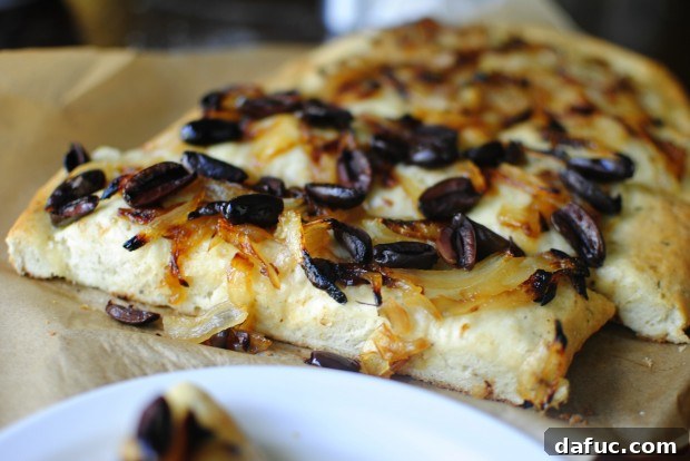 Focaccia close up Herbed Focaccia with Caramelized Onions and Olives, Close Up